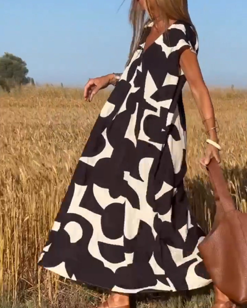 NAOMI™ | Abito Lungo Stampato con Scollo a V e Linea Svasata per un Look Estivo